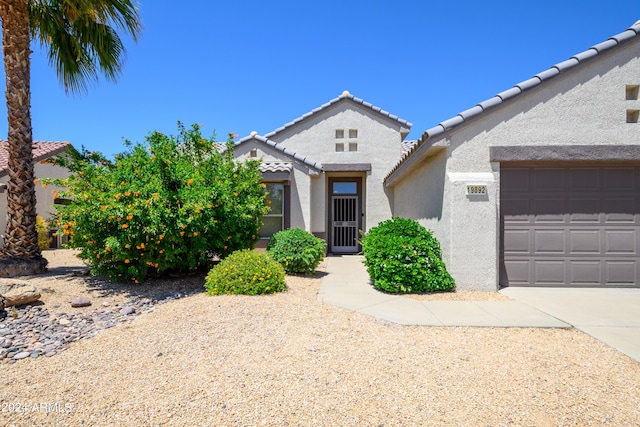 19892 N Shadow Mountain Dr, Surprise, AZ 85374 - view of front of house with a garage, stucco siding, a tiled roof, and concrete driveway