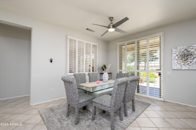 19892 N Shadow Mountain Dr, Surprise, AZ 85374 - dining area featuring light tile patterned floors, baseboards, ceiling fan, and visible vents