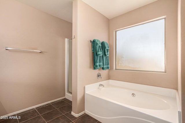 bathroom with tile patterned floors and separate shower and tub