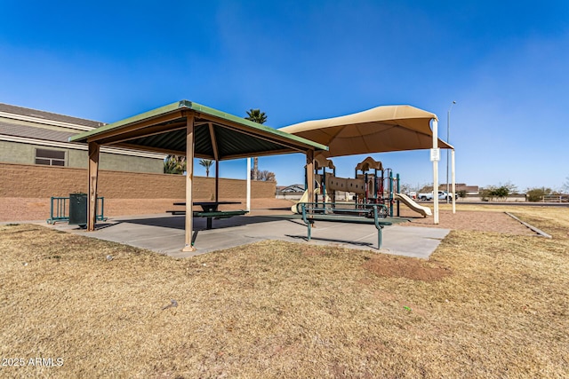 surrounding community with a playground and a lawn