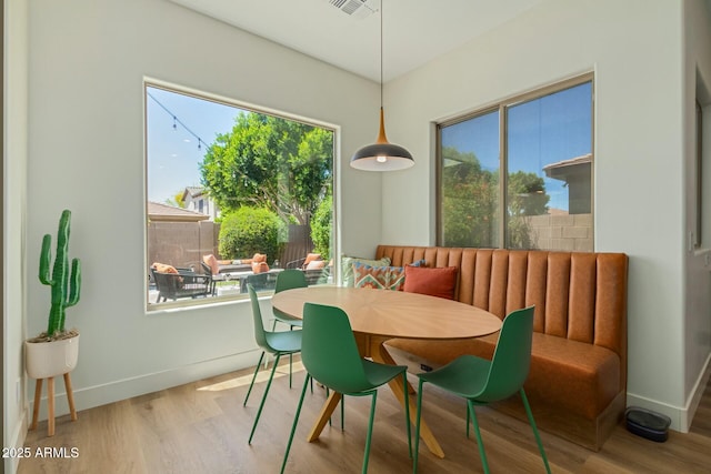 dining room with wood finished floors and baseboards