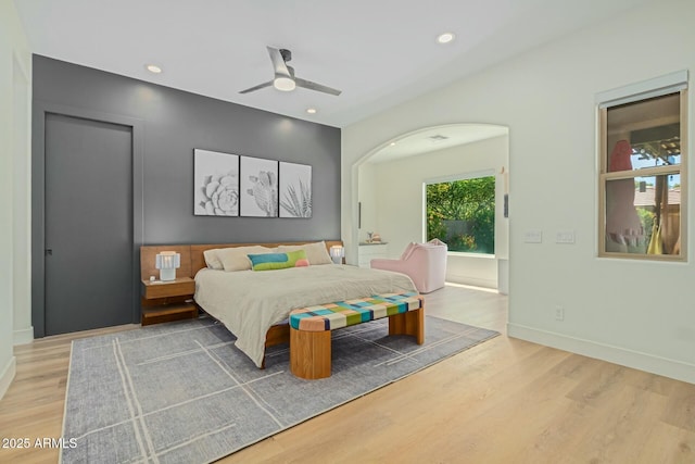 bedroom featuring wood finished floors, baseboards, recessed lighting, and ceiling fan