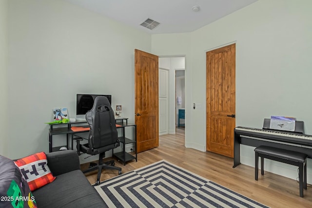 office featuring wood finished floors and baseboards