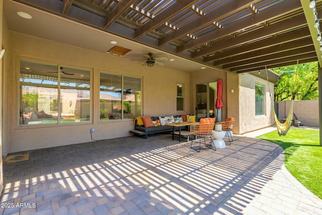 view of patio / terrace featuring a ceiling fan, an outdoor hangout area, a pergola, and fence