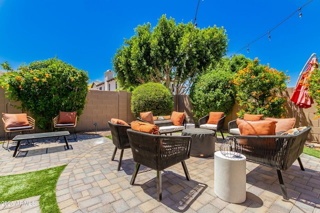 view of patio with an outdoor hangout area and a fenced backyard