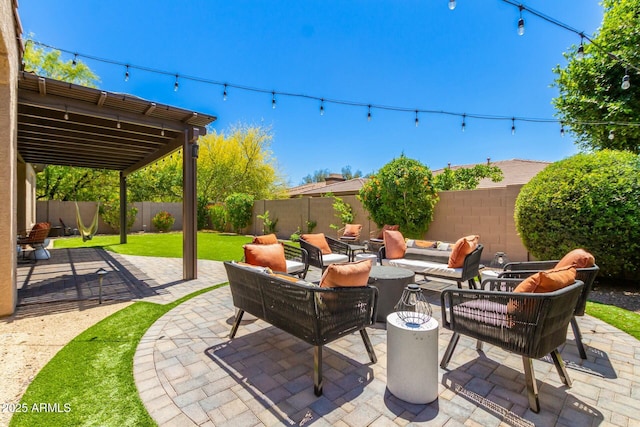 view of patio featuring an outdoor living space and a fenced backyard