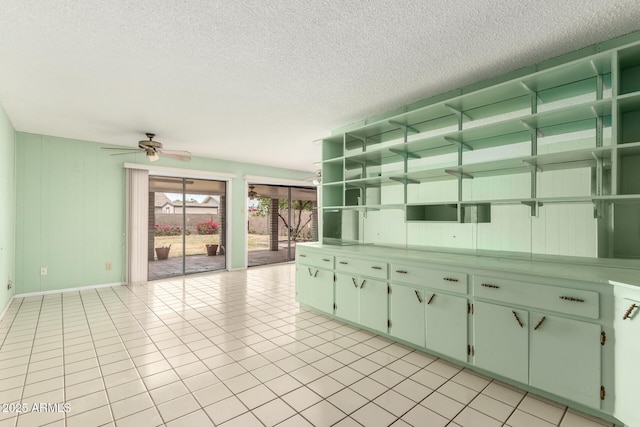 4062 W Mescal St, Phoenix, AZ 85029 - kitchen featuring open shelves, a textured ceiling, a ceiling fan, baseboards, and light tile patterned floors
