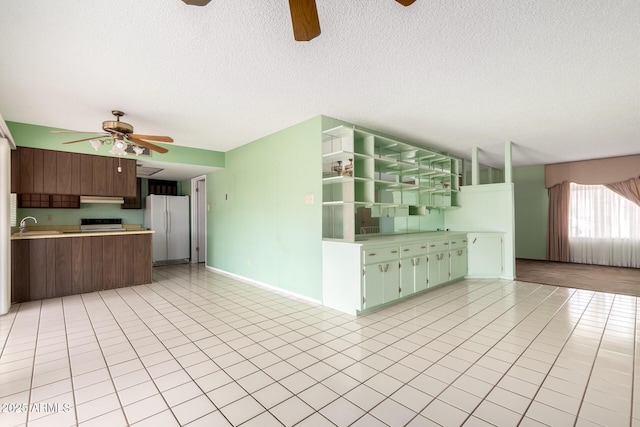 4062 W Mescal St, Phoenix, AZ 85029 - kitchen featuring a ceiling fan, freestanding refrigerator, open floor plan, light countertops, and under cabinet range hood
