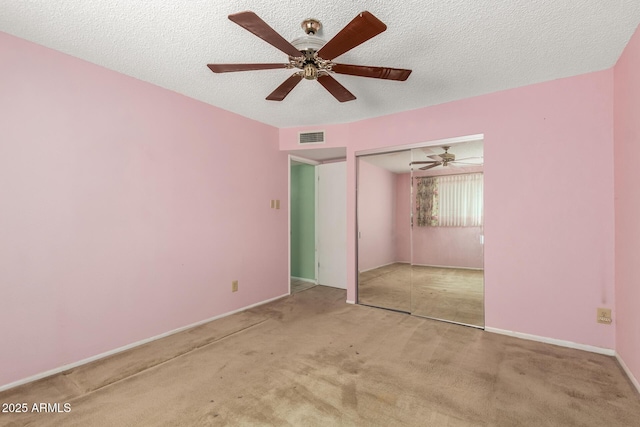 4062 W Mescal St, Phoenix, AZ 85029 - unfurnished bedroom with carpet flooring, a closet, ceiling fan, a textured ceiling, and baseboards