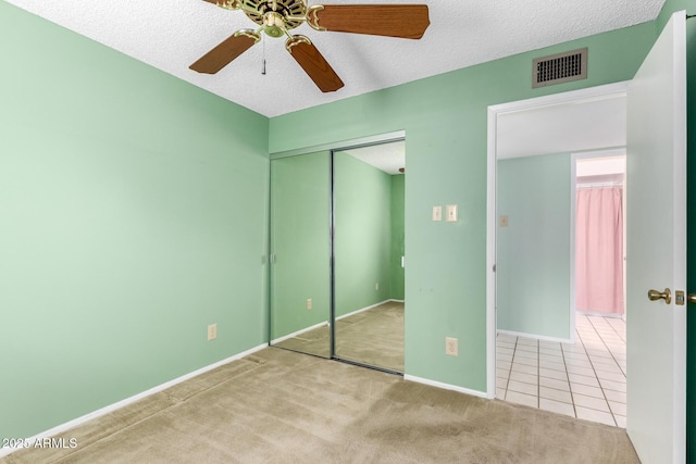 4062 W Mescal St, Phoenix, AZ 85029 - unfurnished bedroom featuring a closet, a textured ceiling, carpet flooring, baseboards, and a ceiling fan