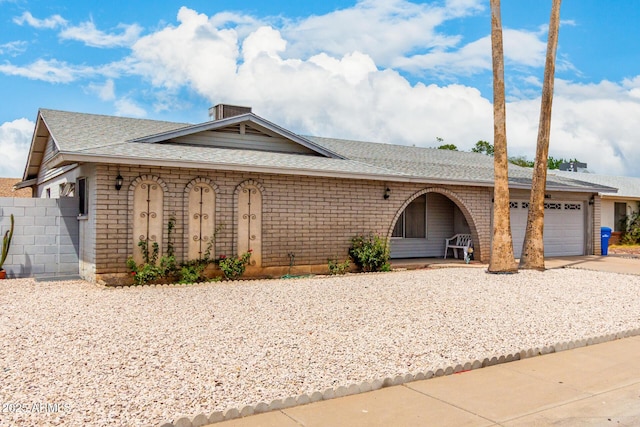 4062 W Mescal St, Phoenix, AZ 85029 - single story home with driveway, roof with shingles, a garage, and brick siding
