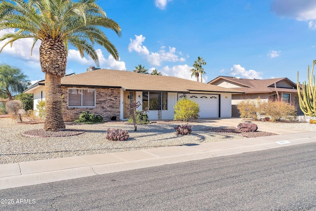 ranch-style home featuring a garage