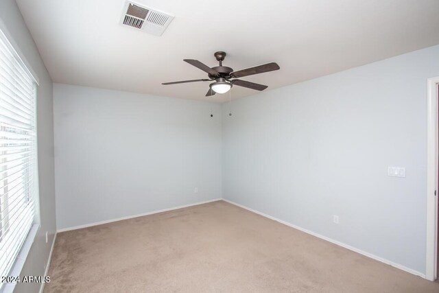 carpeted empty room with ceiling fan