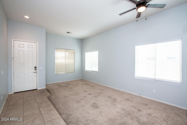 carpeted empty room with ceiling fan