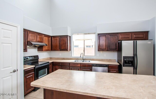 kitchen with sink, appliances with stainless steel finishes, and light tile patterned floors