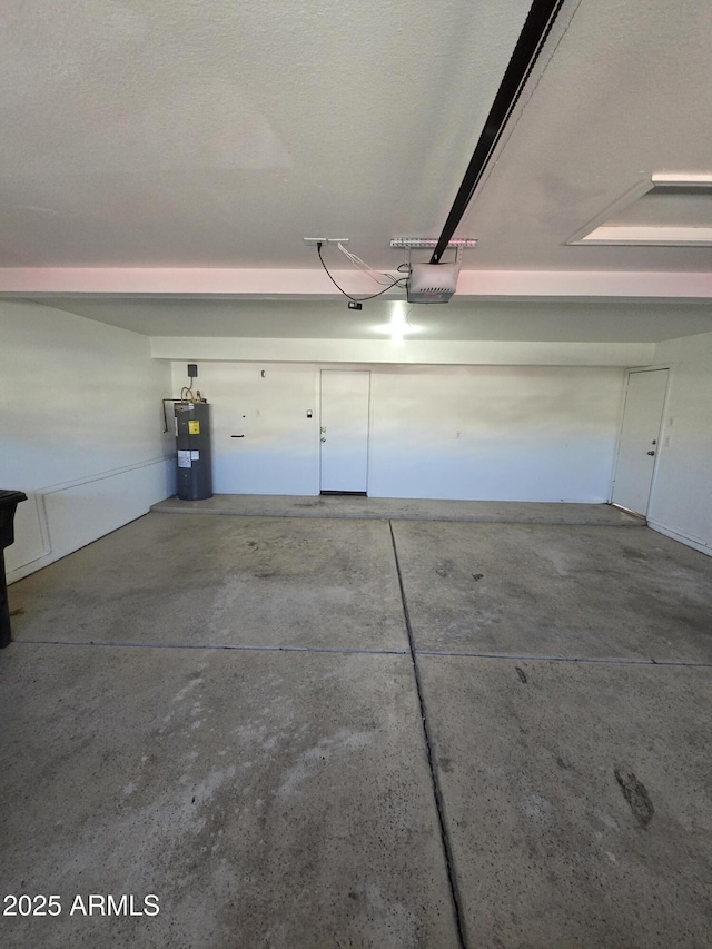 garage with a garage door opener and electric water heater