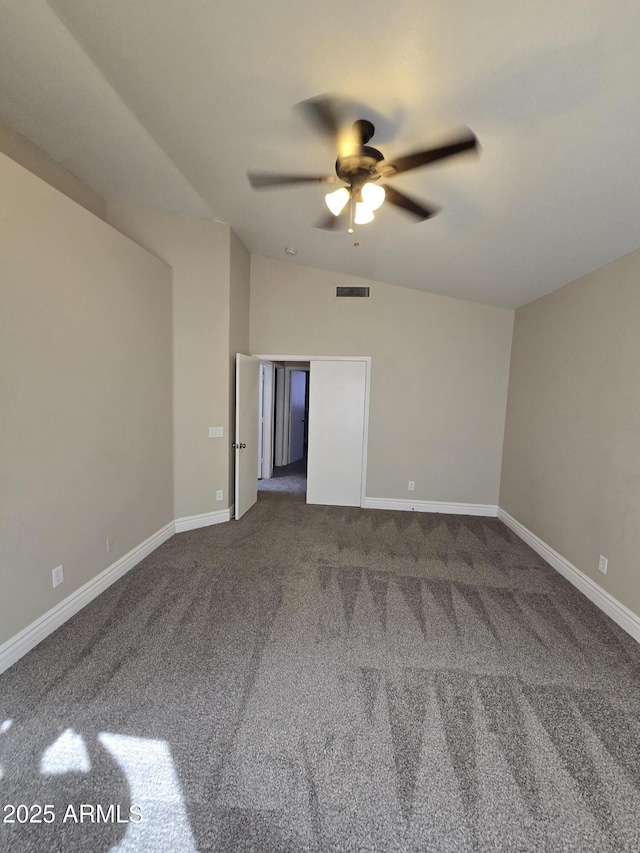 empty room with vaulted ceiling and ceiling fan