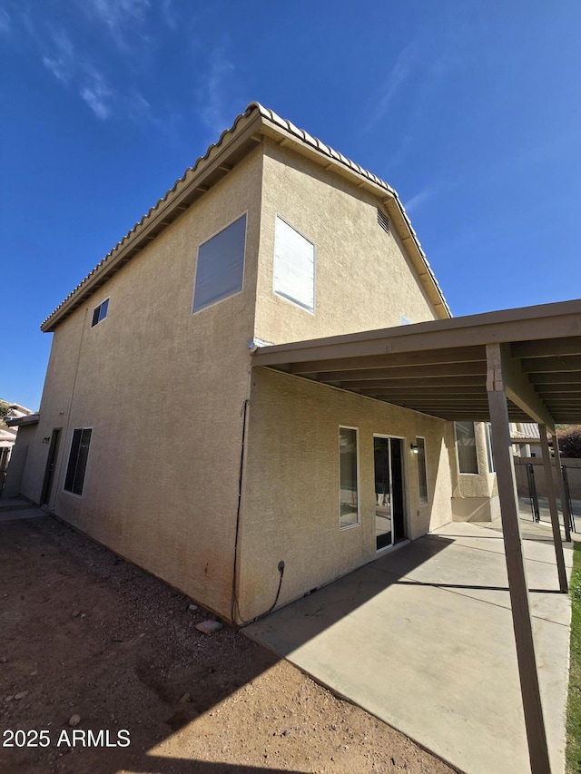 back of house with a patio area