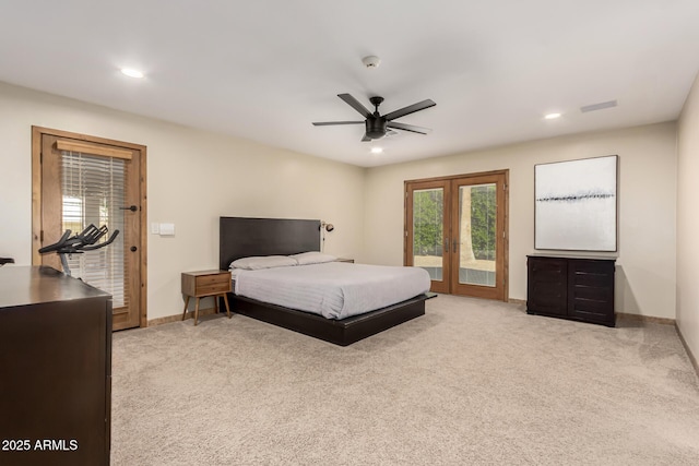 bedroom with french doors, light colored carpet, visible vents, access to outside, and baseboards