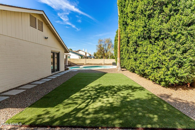 view of yard featuring a fenced backyard and a fenced in pool