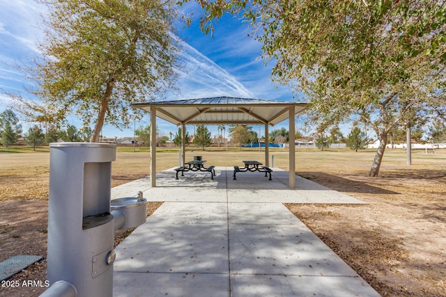 surrounding community with a yard and a gazebo