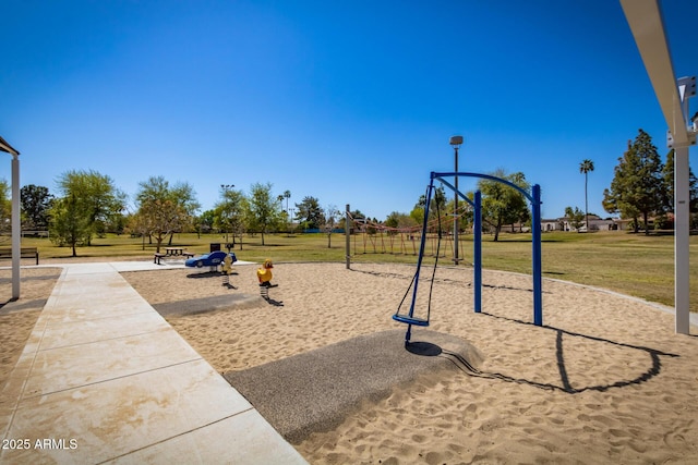 community playground featuring a lawn