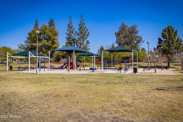 community jungle gym with a lawn