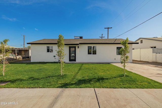 ranch-style home with a front yard