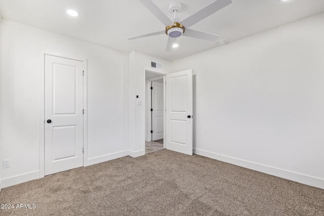 unfurnished bedroom featuring ceiling fan, a closet, and carpet floors