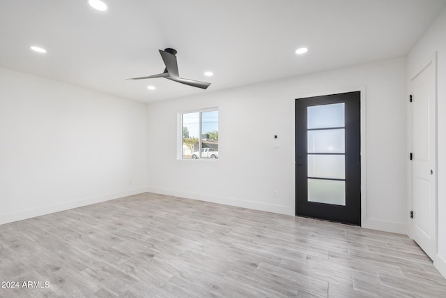 empty room featuring light hardwood / wood-style floors and ceiling fan