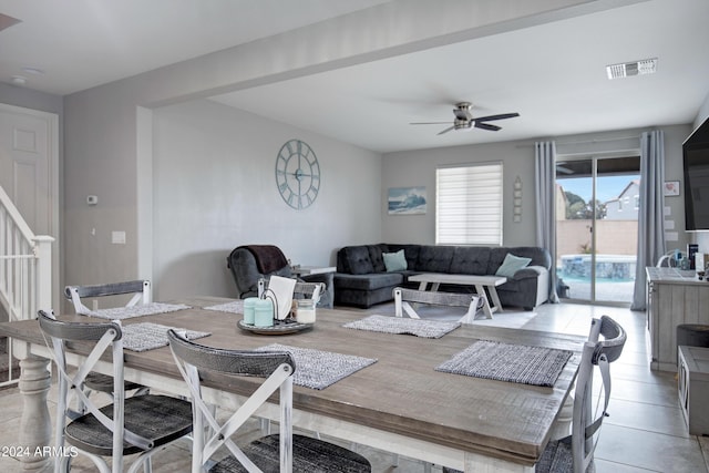 tiled dining room with ceiling fan