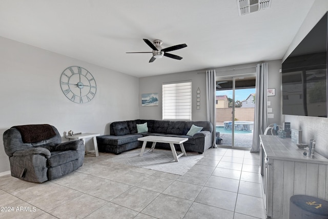 living room featuring ceiling fan and light tile patterned floors