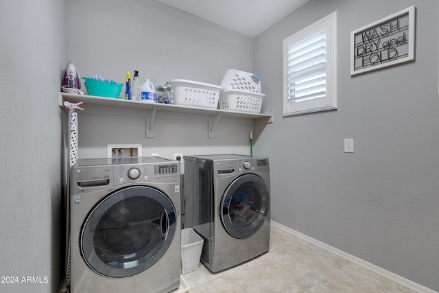 laundry room featuring washing machine and dryer