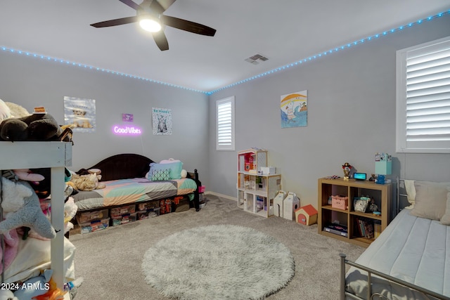 bedroom with carpet floors, ceiling fan, and lofted ceiling