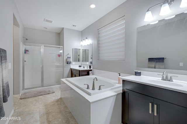 bathroom with vanity, tile patterned floors, and independent shower and bath