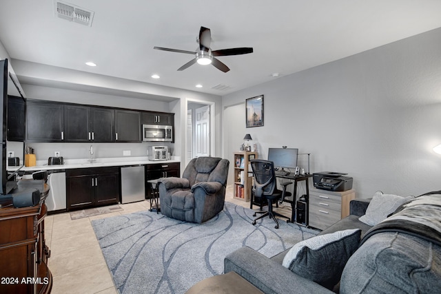 interior space featuring ceiling fan and light tile patterned floors