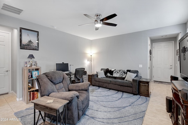 tiled living room with ceiling fan