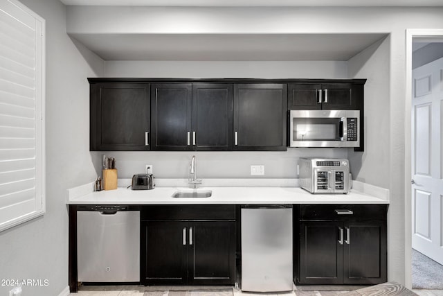 kitchen with sink and appliances with stainless steel finishes