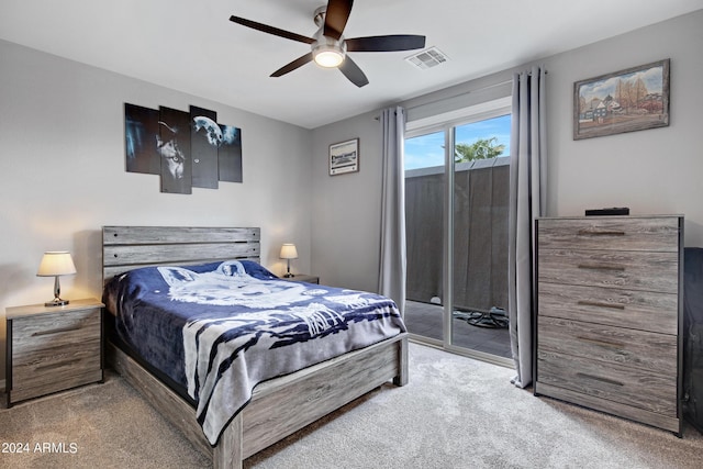 bedroom with access to outside, ceiling fan, and light colored carpet