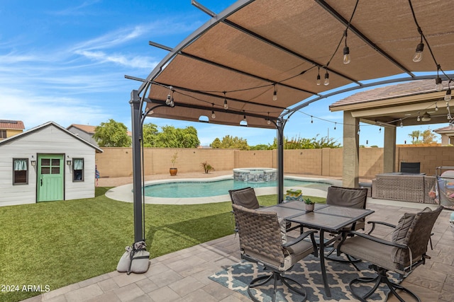 view of patio with a fenced in pool and an outdoor structure