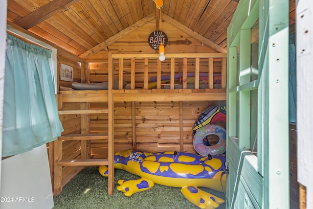 bedroom featuring carpet flooring, lofted ceiling, and wood ceiling