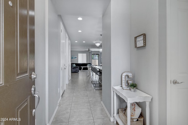 corridor featuring light tile patterned floors