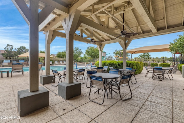 view of patio / terrace featuring ceiling fan and a community pool