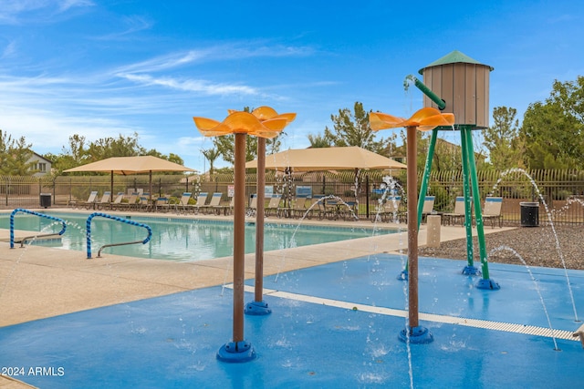 view of pool with pool water feature and a patio area