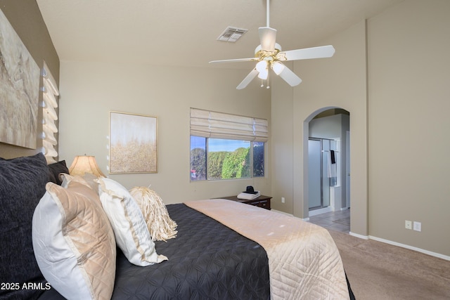 bedroom with high vaulted ceiling, light colored carpet, and ceiling fan