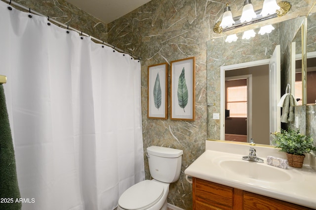 bathroom with vanity, curtained shower, and toilet