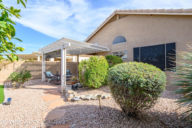 exterior space with a patio area and a pergola