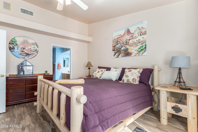 bedroom featuring ceiling fan, ensuite bathroom, and wood-type flooring