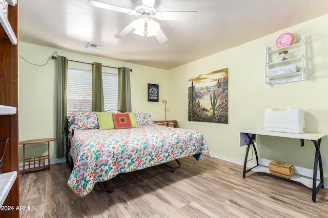 bedroom featuring ceiling fan and hardwood / wood-style floors