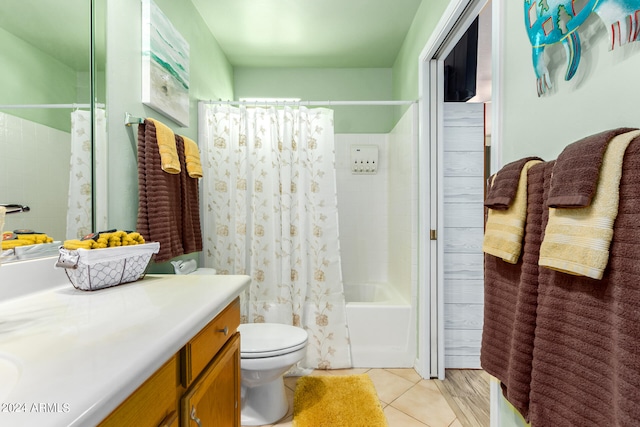 full bathroom with toilet, shower / tub combo, tile patterned floors, and vanity